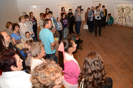 The opening continues in the exhibition space.